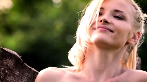 Petite blonde MILF posing in the nature