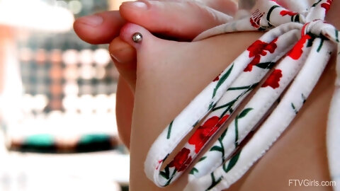 Cute red-haired doll reveals her slutty nature under the bright sunlight.