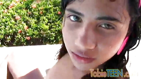 Tobie teen masturbating outdoors by the pool