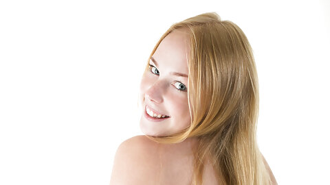 Teen girl with red hair removes her black bikini for nude solo posing