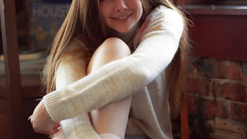 Gorgeous girl Lana Lea removes a sweater and shorts to model in the nude